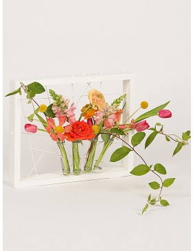 White frame with test tubes for flowers